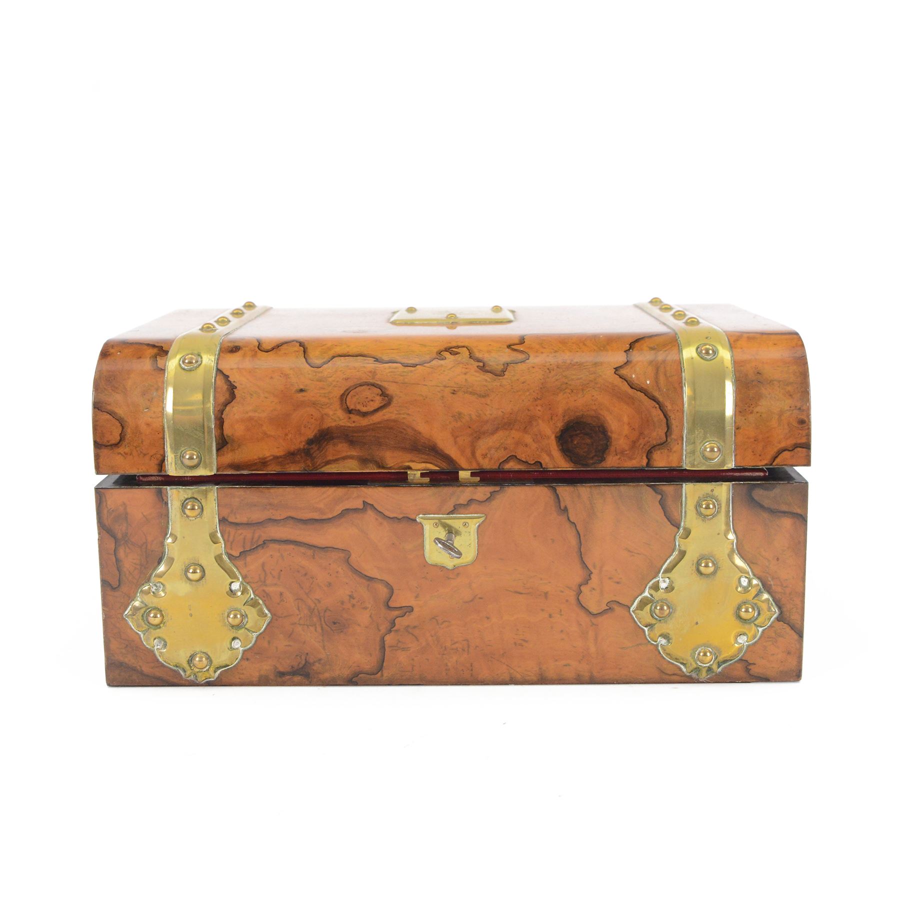 19th century walnut and brass bound games compendium box, painted to enhance the grain, of rectangular form, the hinged opening cover with rounded sides, central brass cartouche with engraved lion crest, and brass riveted straps, opening to reveal a red leather and blue silk lined compartmented interior, with fold-down games board, and lift-out tray containing playing cards, ebony turned dice towers, white and red stained bone draughts, and chess pieces, ivory dice, and ivory and ebony whist markers, and brass bezique board, cribbage board and markers, H15cm W32cm D24cm
This lot has been registered for sale under Section 10 of the APHA Ivory Act