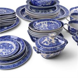 Collection of blue and white dinner wares, mainly Wedgwood Willow pattern, including serving platter, dinner plates etc   