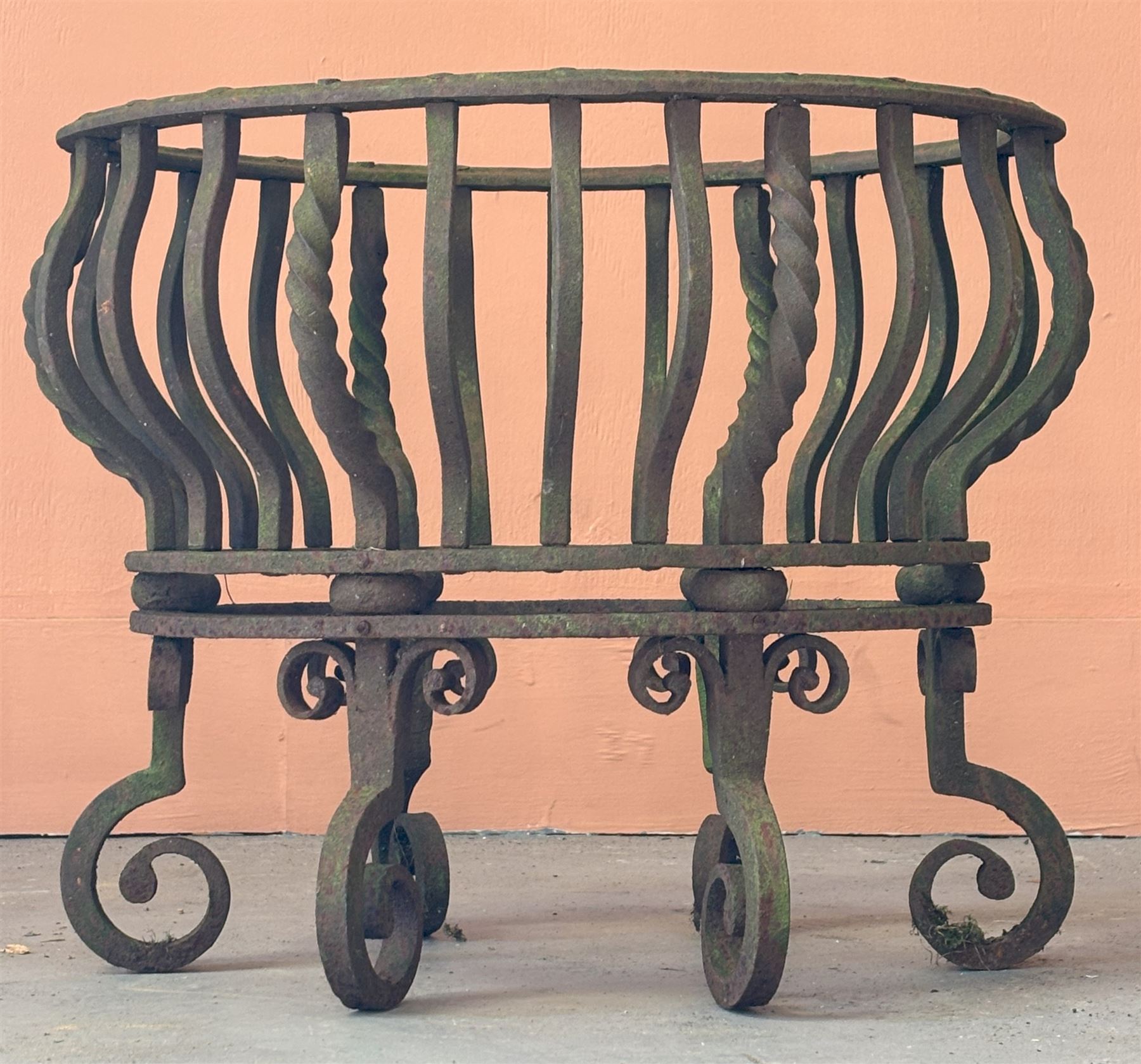 Wrought iron dog grate of oval outline, raised on six scrolled supports. H42cm, W52cm, D41cm.  - COLLECTION BY APPOINTMENT FROM: The White House, Thirsk Road, Easingwold, York, YO61 3NF - CALL 01723 507111 TO ARRANGE