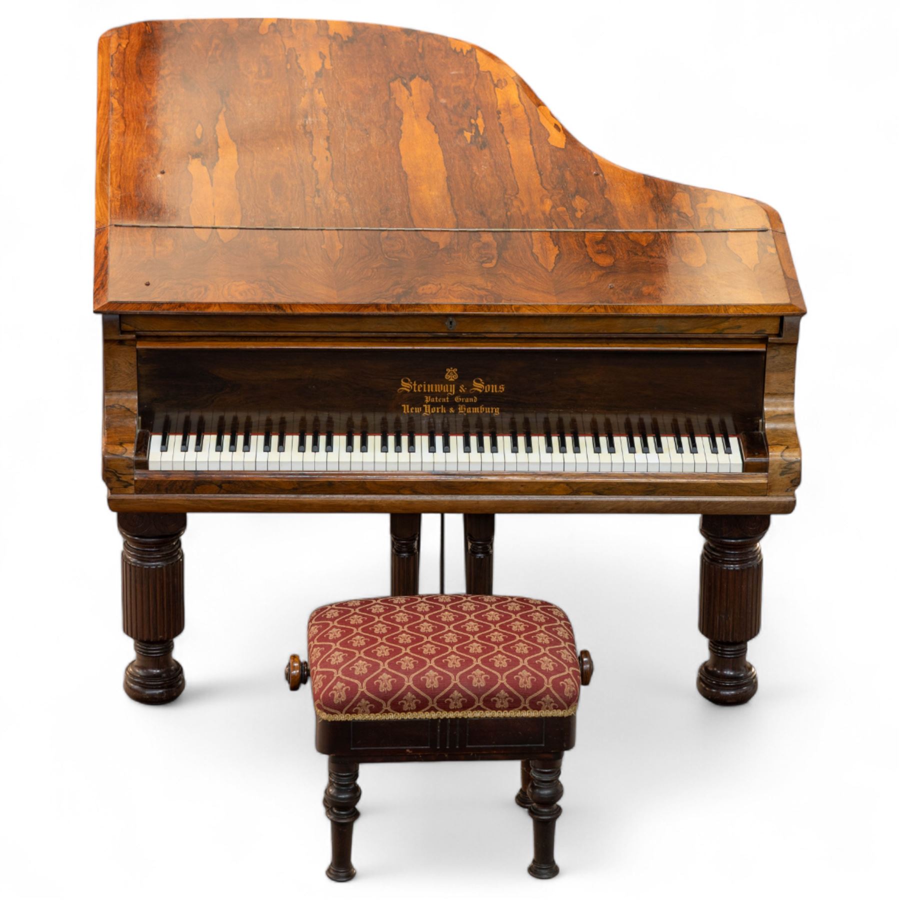 Steinway & Son, New York & Hamburg- Model B, overstrung Drawing Room Grand Piano in a rosewood case, Serial No 87297 (1896/7), with 85 ivory covered and ebony keys A0-A7(7 octaves) with an adjustable fretted music desk, brass fittings and pedals, Steinway “Fireplug” straight columnar and fluted legs with roller castors and conforming lyre, duplex stringing with agraffs, bass strings copper wound with a steel core, steel tuning pins, original Steinway action, hammers, keys, felts, and dampers, with una-corda, sostenuto and sustain pedals, Overstrung iron frame detailing numerous Steinway patents, awards, and features. Tuned to Concert pitch (A=440). 
With an adjustable single stool. 

This item has been registered for sale under Section 10 of the APHA Ivory Act HLB1KY67