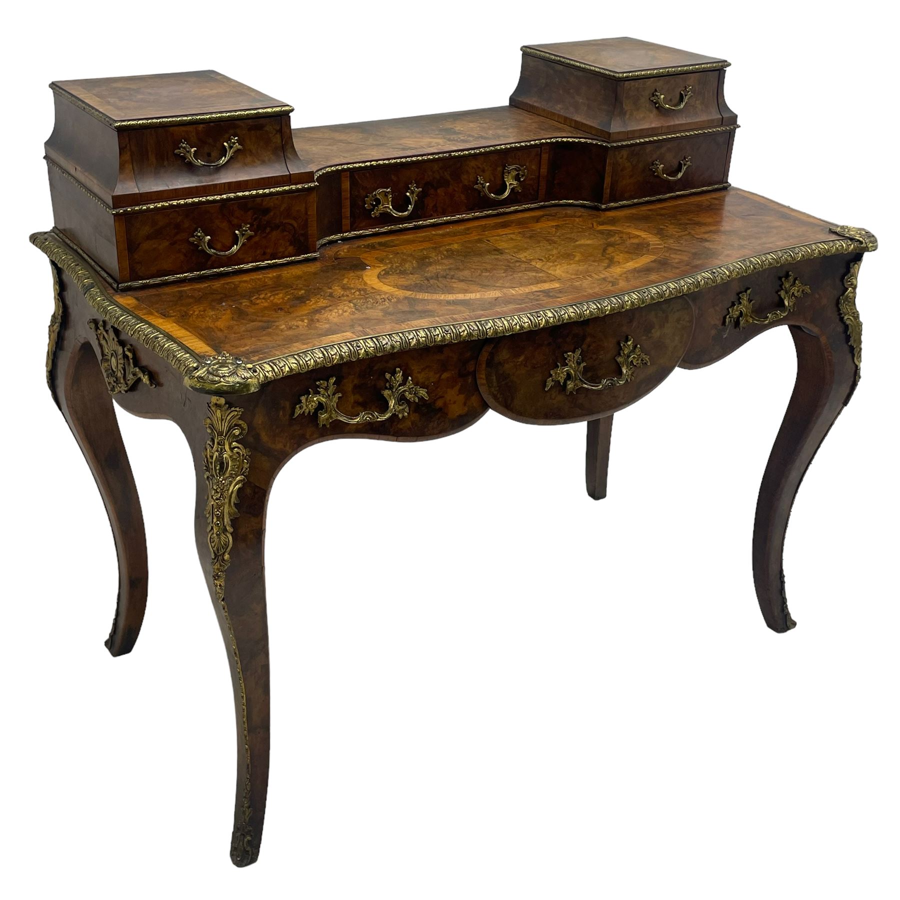 Late 19th to early 20th century French figured walnut writing desk, raised back fitted with drawers, shaped top with Kingwood banding and foliage cast edge moulding, fitted with single drawer, on cabriole supports mounted by shell and flower head cartouches 