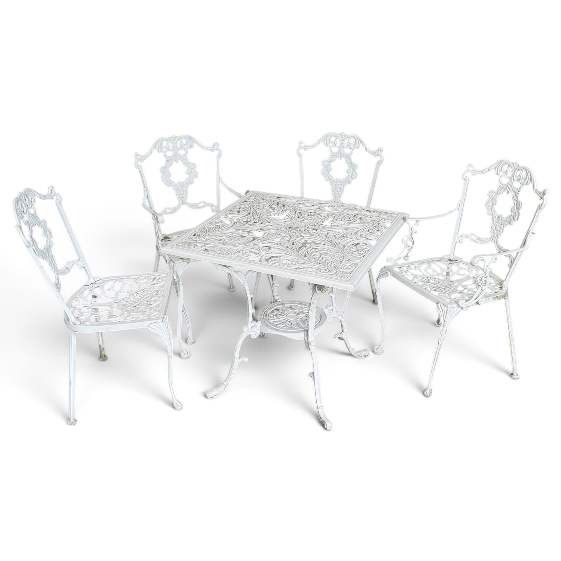 Regency design white-painted aluminium garden table, square pierced top with scrolling acanthus leaf decoration, splayed supports joined by pierced circular under-tier (W75cm H72cm), the chairs with scrolling and floral garland design backs over pierced foliate seats with cabriole supports (W48cm H90)