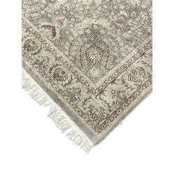 Chinese washed woollen camel ground rug, circular medallion surrounded by scrolls, the border decorated with birds and trailing floral decoration (248cm x 155cm); Chinese washed woollen pale green ground rug (125cm x 69cm); Persian design rug (186cm x 121cm) (3)