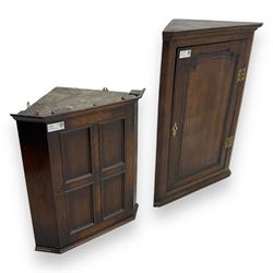 Early 20th century wall mounted oak corner cabinet, moulded cornice over panelled door enclosing single fixed shelf (W60cm, D40cm, H66cm); 19th century oak corner cabinet, panelled door enclosing three shaped shelves (W65cm, D35cm, H92cm)