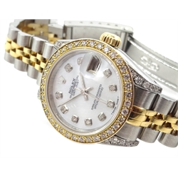 Rolex Oyster Perpetual Datejust chronometer ladies bi-metal wristwatch with mother of pearl dial, diamond hour markers, bezel and lugs model 69173 serial no R395211 boxed with tag  