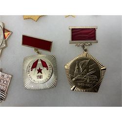 Nineteen Russian Soviet Tank Commemoration badges and medals, in small display case