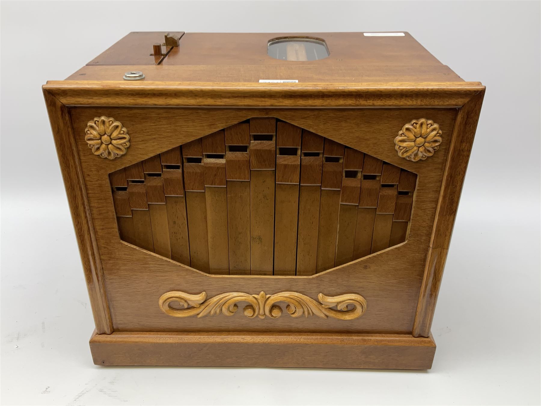 Small scratch built wooden John Smith style twenty-note busker organ with thirteen paper music rolls, other paper music and soft toy monkey