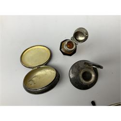 German silver pill box of oval form, the cover decorated with a serpent, stamped with crown and crescent and marked 800, together with a miniature silver capstan inkwell with glass liner, hallmarked Birmingham, a novelty silver teaspoon with golf club terminal, hallmarked Birmingham, and an amber glass scent bottle with silver plated cover, approximate weighable silver (not including inkwell or scent bottle with silver plated cover) 41.9 grams