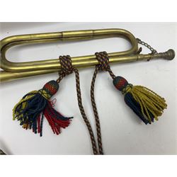 Two military brass bugles by Mayers and Harrison Ltd. Manchester each with crows foot mark and dated 1966; both with multi-coloured cord and tassels, longest 52.5cm (2)