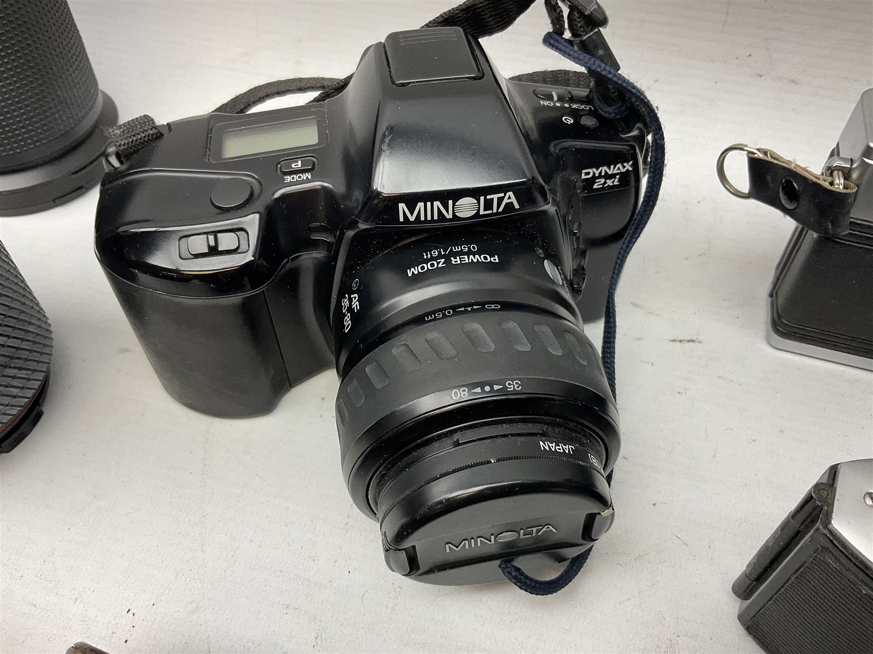 Collection of cameras and equipment, to include Minolta Dynax 2xi, Praktica MTL5B,  Ilford Vario, 'Sunactinon Auto Zoom 1:4.5 f=80-200mm' lens, 'Miranda 35-70mm 1:3.5-4.5 MC Macro' lens etc