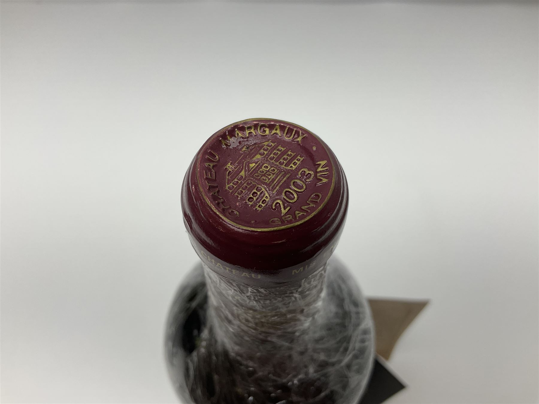 Chateau Margaux, 2003, Margaux, unknown content and proof, this bottle has depressed cork and signs of seepage
