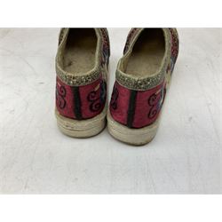 French silver plated wine taster of typical form, stamped, together with a silver plated napkin ring, and an 'Alpaca Silver' pill box with mother of pearl detailed cover, (3) together with Two pairs of late 19th/early 20th century Chinese Lotus shoes for binding feet, the first with purple silk heavily embroidered with ornate floral motifs, L10cm the second larger fuschia and black pair with thicker sole embroidered with flowers, L14cm