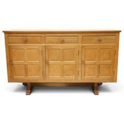 Beaverman - 1980s adzed oak sideboard raised on a trestle base, three drawers over three c...
