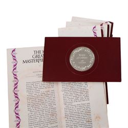John Pinches 'The 100 Greatest Masterpieces' set of one hundred silver medallions, each on presentation card with information leaflet, together with the corresponding wooden display cabinet