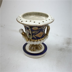 Three Bloor Derby Imari pattern twin handle urms, two examples with covers, each with mark beneath, H12cm, (all a/f), together with a pair of late 19th century Royal Crown Derby Imari pattern urns and covers, each with mark beneath, H13cm, (one significantly a/f). 