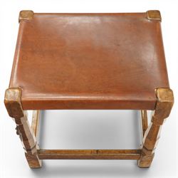 Mouseman - 1940s dark oak dressing table stool, the rectangular top with deep-tan leather seat, raised on octagonal supports united by box stretcher, with carved mouse signature, by the workshop of Robert Thompson of Kilburn
