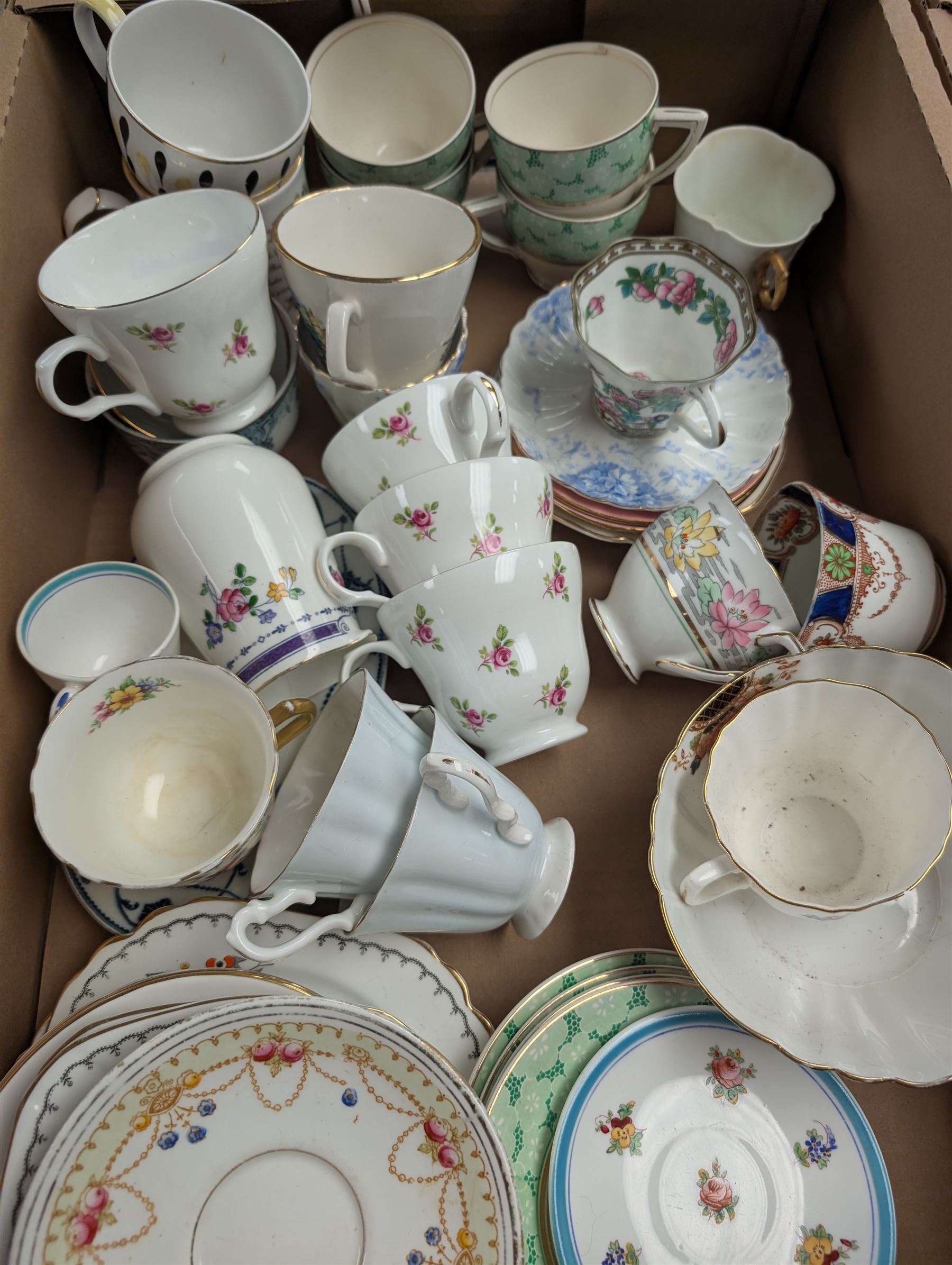 Pair of foo dogs, enamel pans and a collection of teacups, saucers and other ceramics