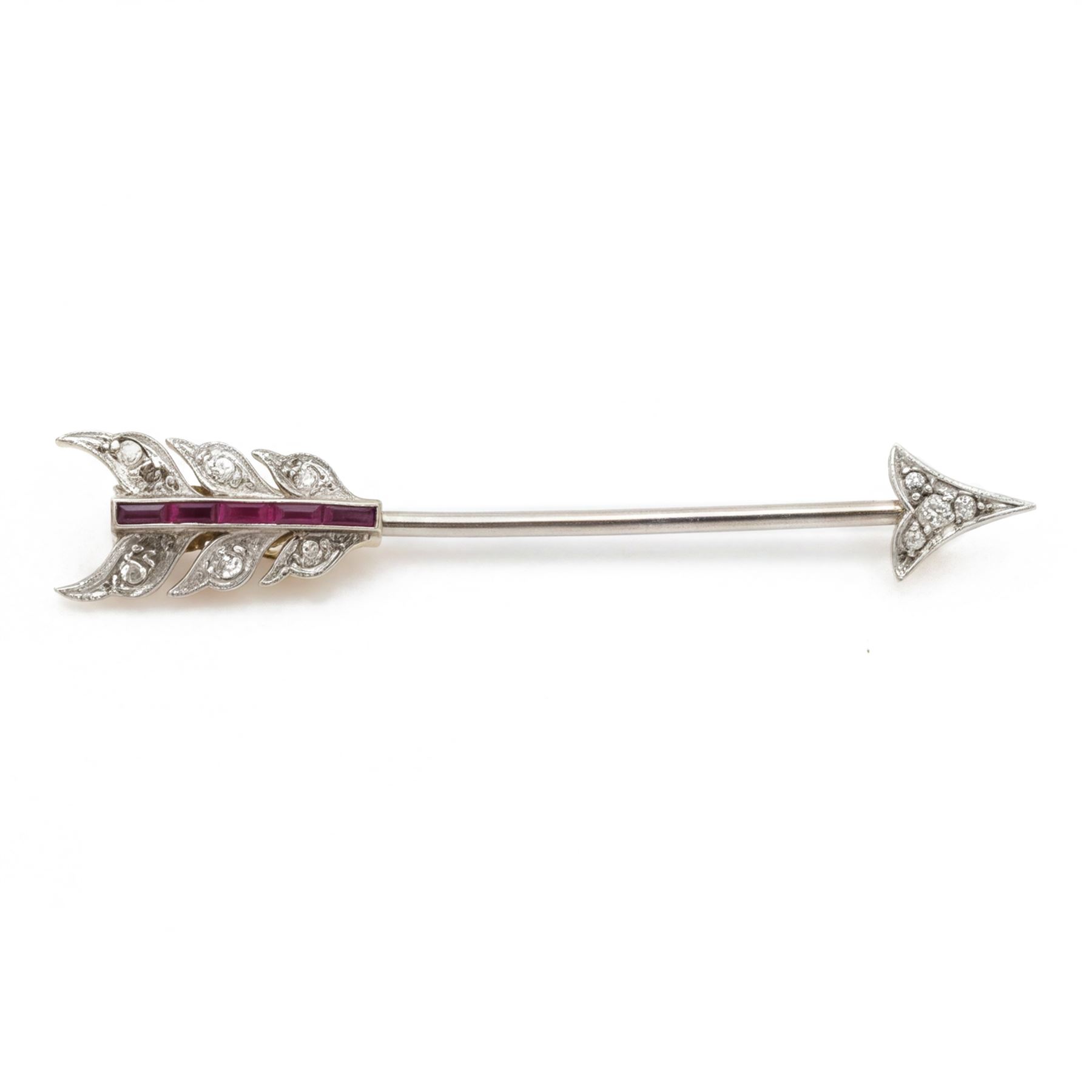 Early 20th century 18ct gold and platinum diamond and ruby arrow brooch