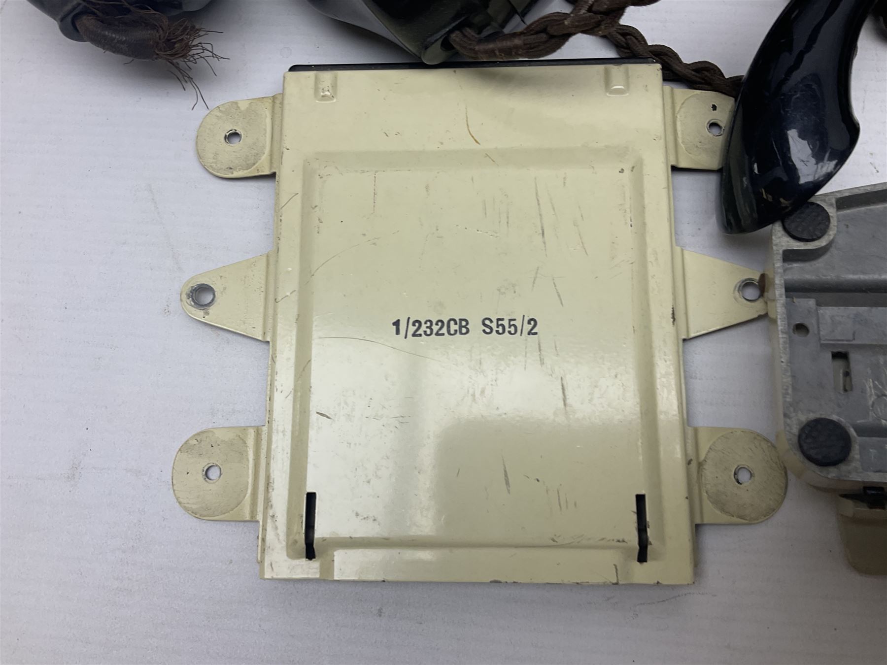 Collection of phone headsets, including GPO bakelite examples, together with other telephone parts 