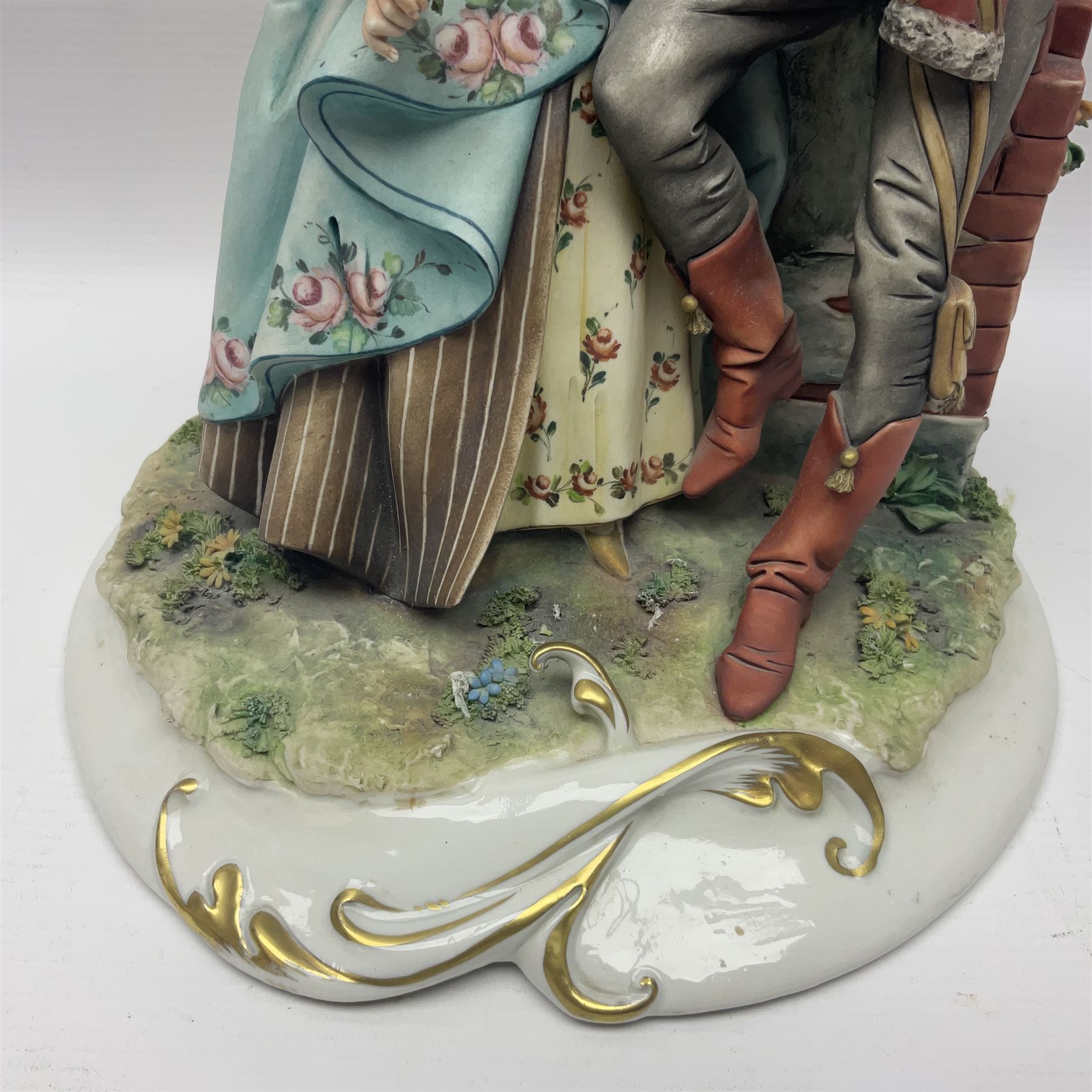 Two Royal Doulton figures, Buttercup HN2309 and Ascot HN2356, together with Capodimonte figure Hussar and His Lady 