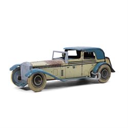 Wells tinplate clockwork limousine, the cream body, with blue roof and lithographed detail...