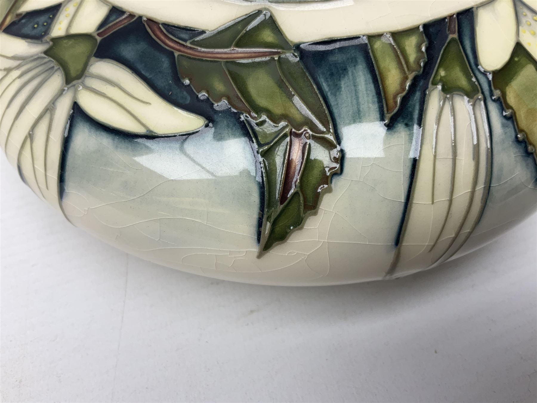 Moorcroft vase, of compressed form with a tall flared neck, decorated in the Juneberry pattern, circa 2000, H25cm