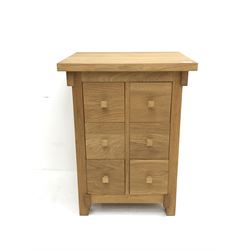 Small light oak chest, six drawers, stile supports 