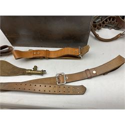 Assorted militaria including ten leather or canvas cartridge and other belts, maroon beret with 17th Lancers cap badge, modern bullet mould, leather and brass shot flask, two knives, shell cases, boomerang etc; in tin deed box