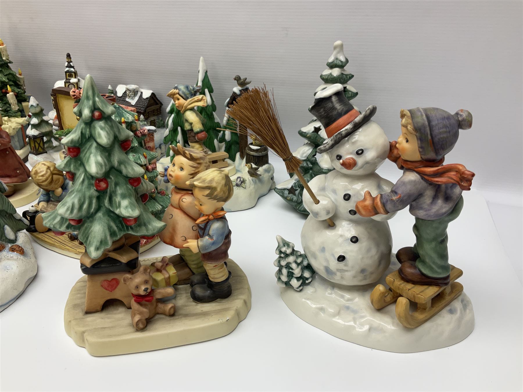 Large collection of Christmas themed Hummel figures and Hummel scapes by Goebel, to include Winter Friend, Making New Friends, Tree Trimming Time, Winter Adventure etc