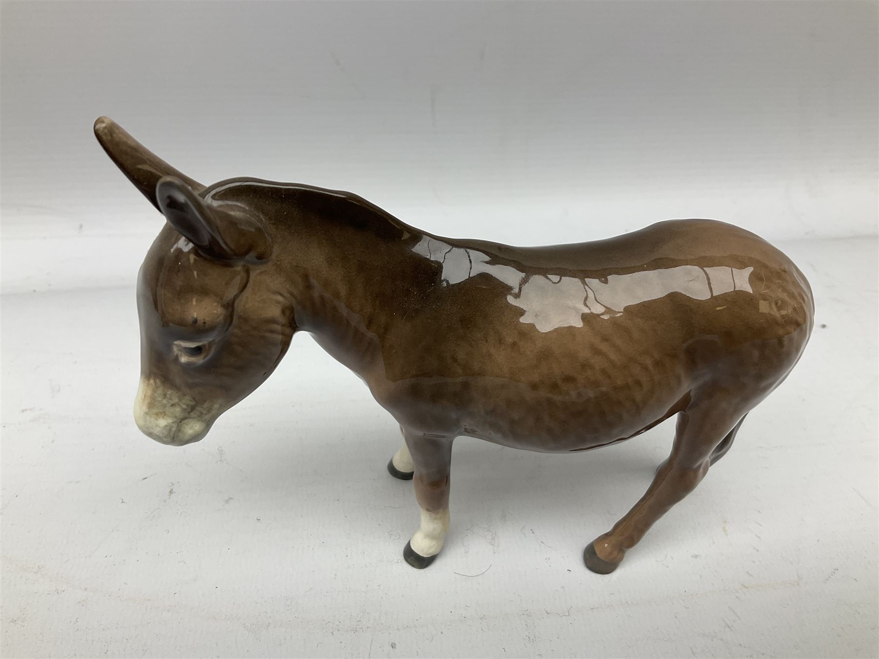Beswick donkey family to include no.1364b, no.2267a, another donkey and donkey foal (4)