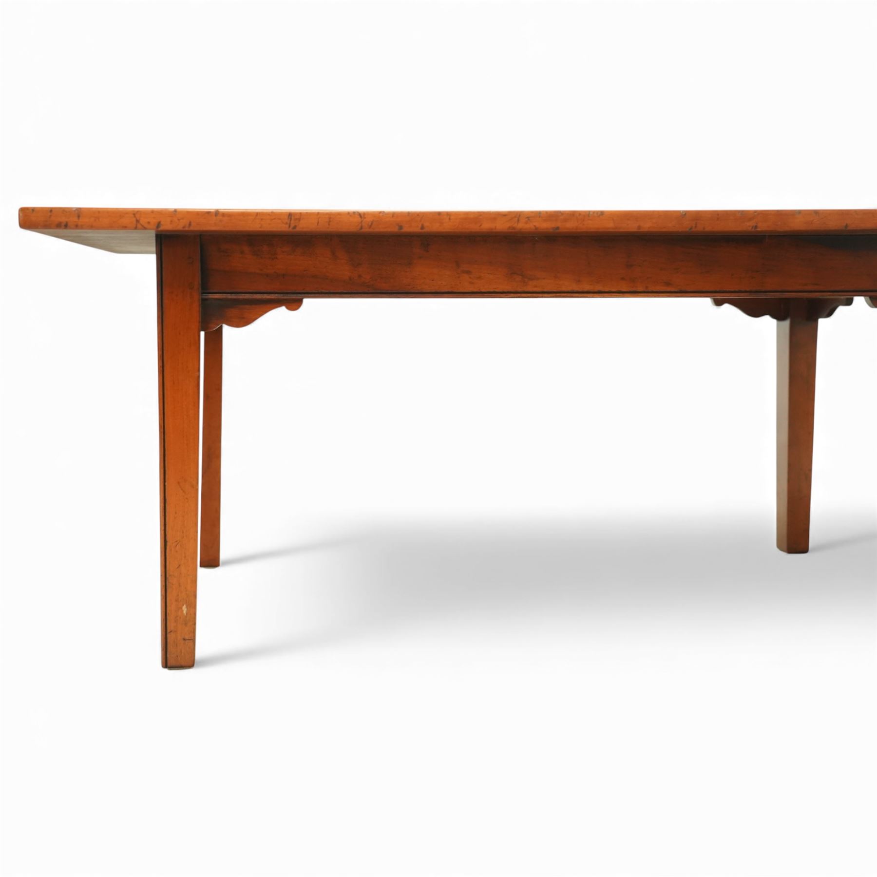 Mid 20th century french hardwood coffee table, rectangular top with gently chamfered edge, raised on square tapering supports united by simple corner brackets