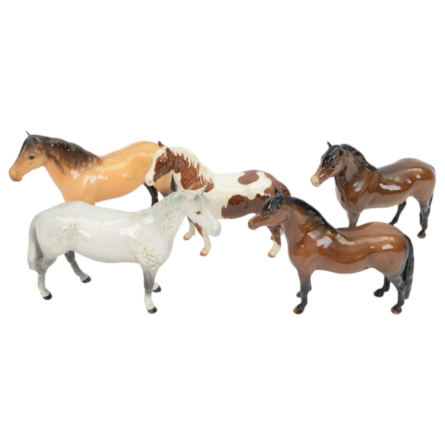 Five Beswick horses, including Skewbald Pinto no 1373, Dartmoor 1642, Dunn Highland no 1644 etc