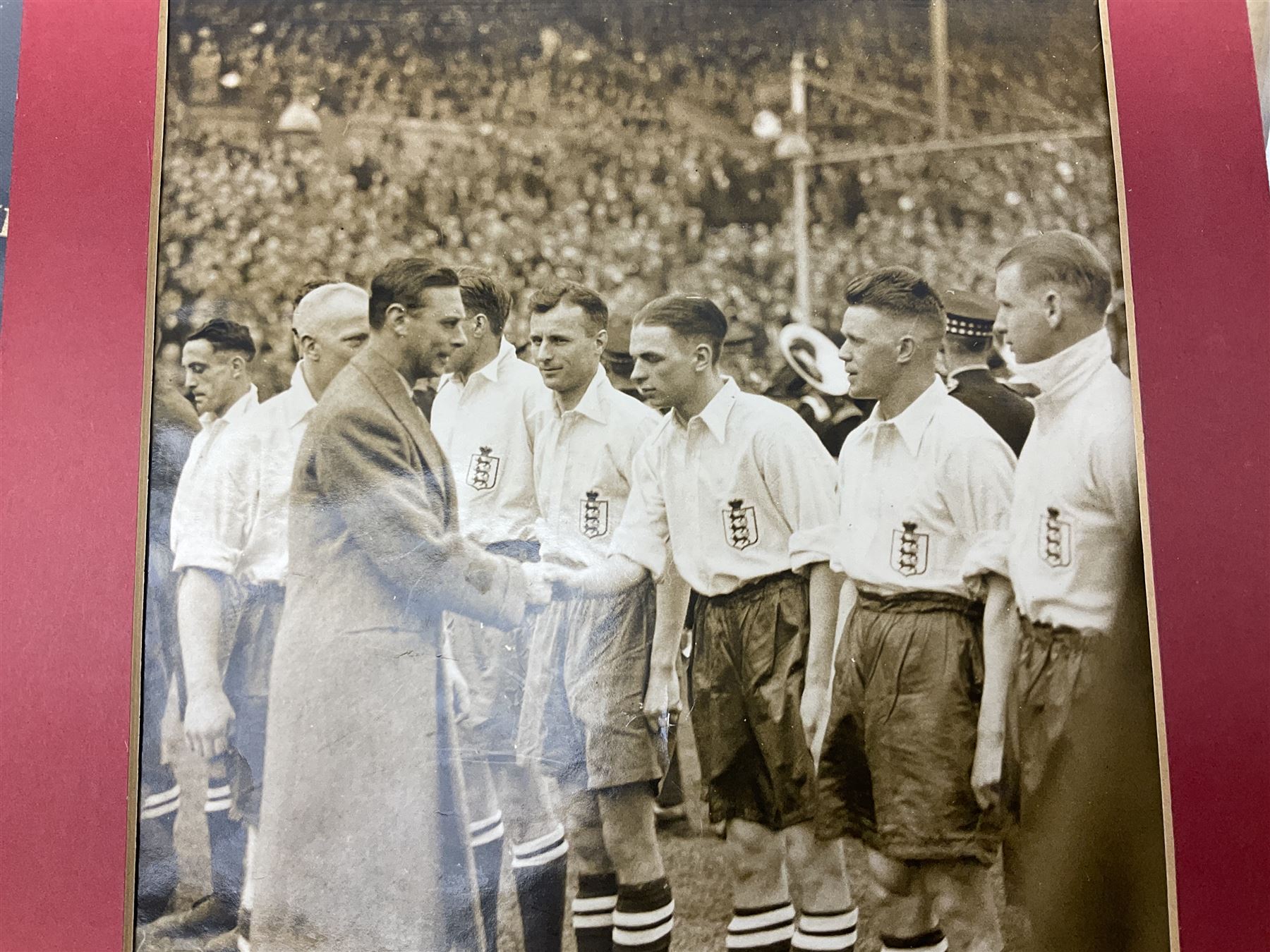 Raich Carter interest - scrap book of a series of articles on his life story for 'Answers' Aug - Oct 1949; scrap book of a proof set of cartoon strips for the Daily Express entitled 'The Raich Carter Story' with accompanying letter dated Dec 1963; photograph of Carter as the only English Schoolboy International to play for two years; photograph of Carter shaking hands with George VI before an England International; two photographs of the '100 years of the FA Cup' match at Wembley; and other paper ephemera. Provenance: By direct descent from the family of Raich Carter having been consigned by his daughter Jane Carter.