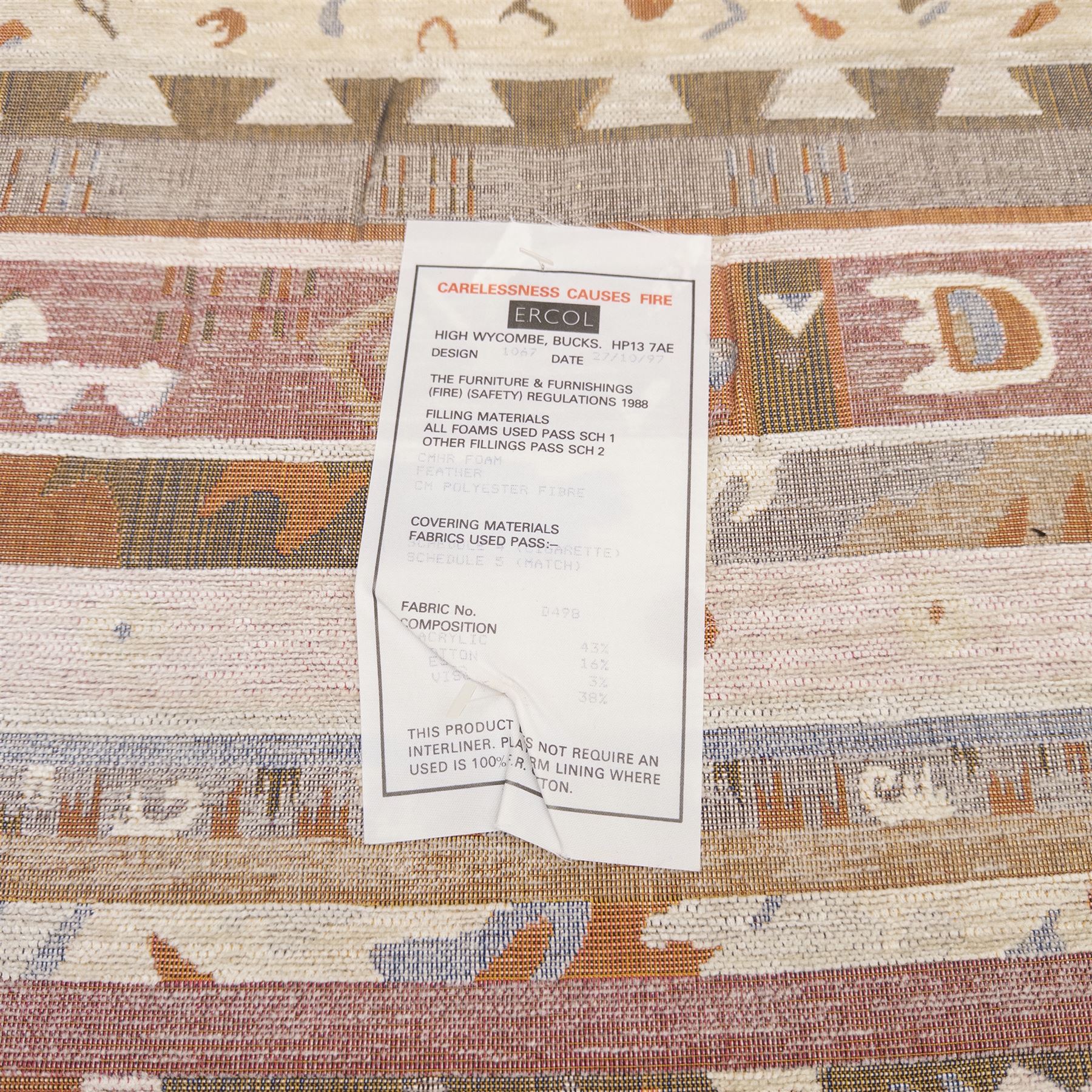 Ercol - Renaissance ash and elm high back armchair, upholstered in geometric Kilim patterned fabric with padded back, seat and arm cushions, curved stick back frame and turned supports