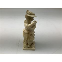 European ivory figure of a woman, 19th century, together with an ivory pen knife shaped as a canon and a ivory cheroot holder