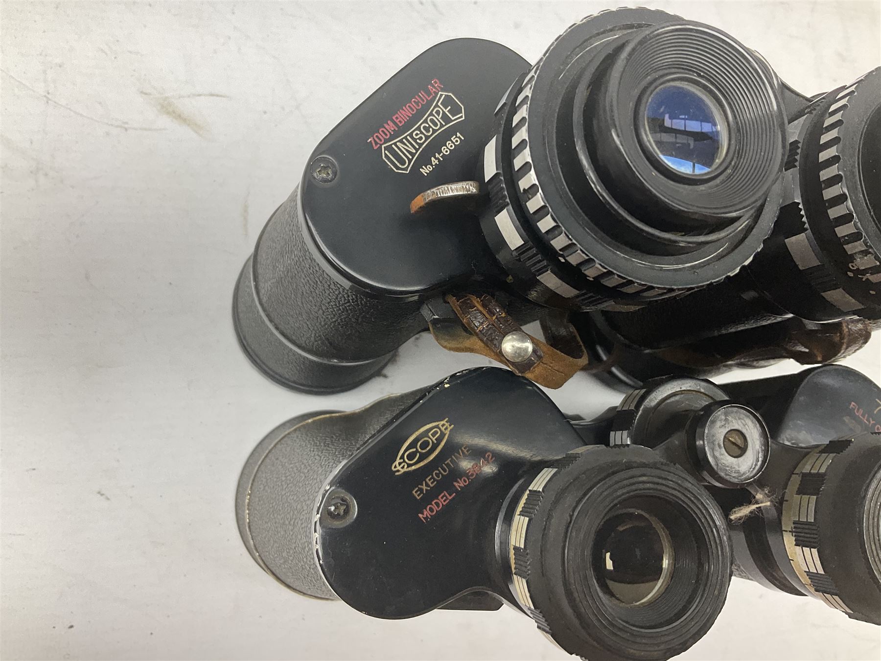 Nine cased pairs of binoculars to include Lieberman & Gortz 12x50, Frank Nipole 8x56, Uniscope, Hoya mark II 8x40, Porst 8x56 etc