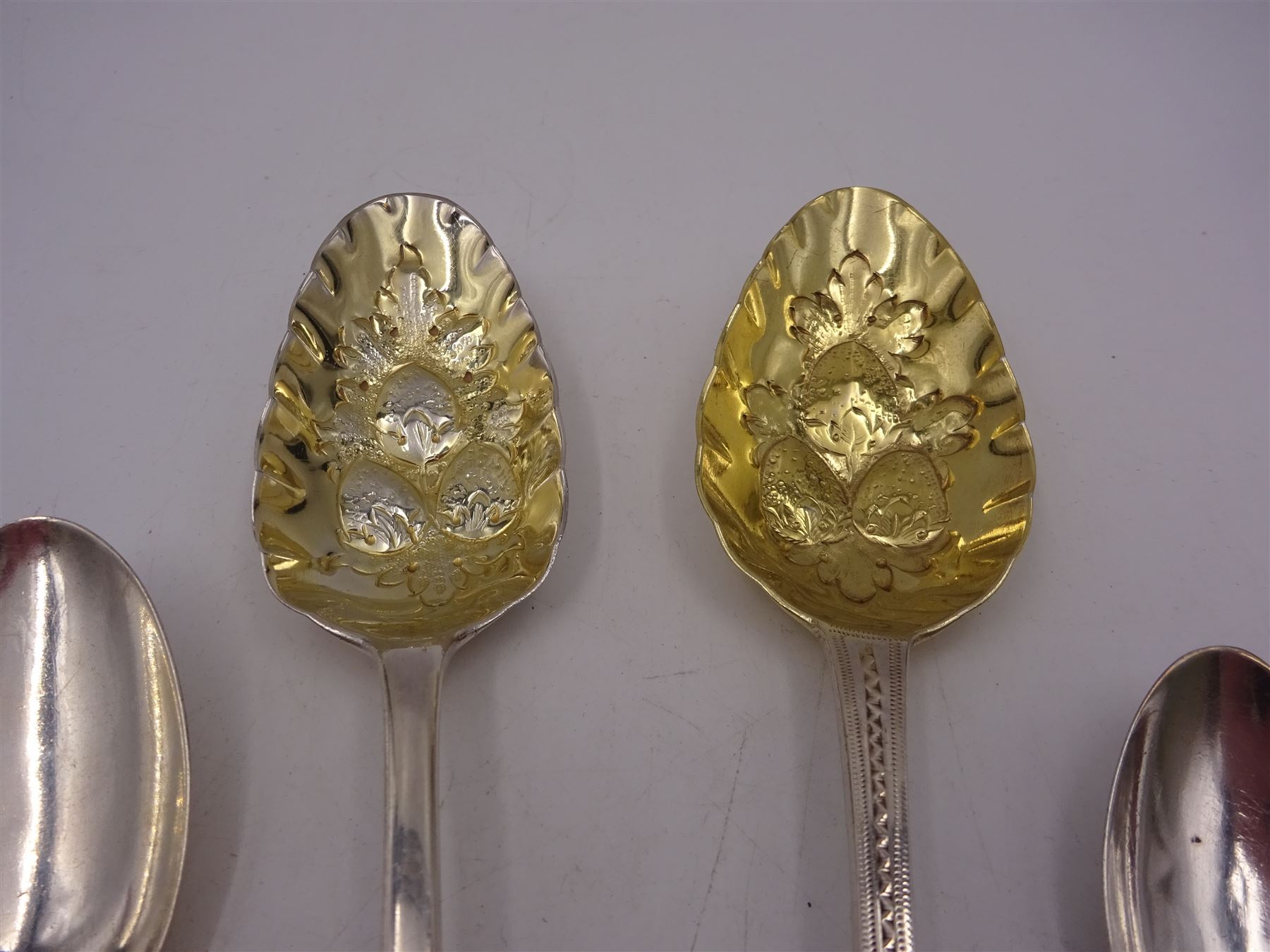 Georgian and later flatware, including two serving spoons, with later struck berry bowls, King's pattern teaspoons, mustard spoons, etc, all hallmarked 