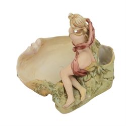 Royal Dux figural bowl, modelled as a young lady lying beside a shell, impressed 562`to base, together with Royal Dux Dutch girl figural baskets, modelled with geese and chickens next to woven baskets, impressed 2278 to base, largest H26cm