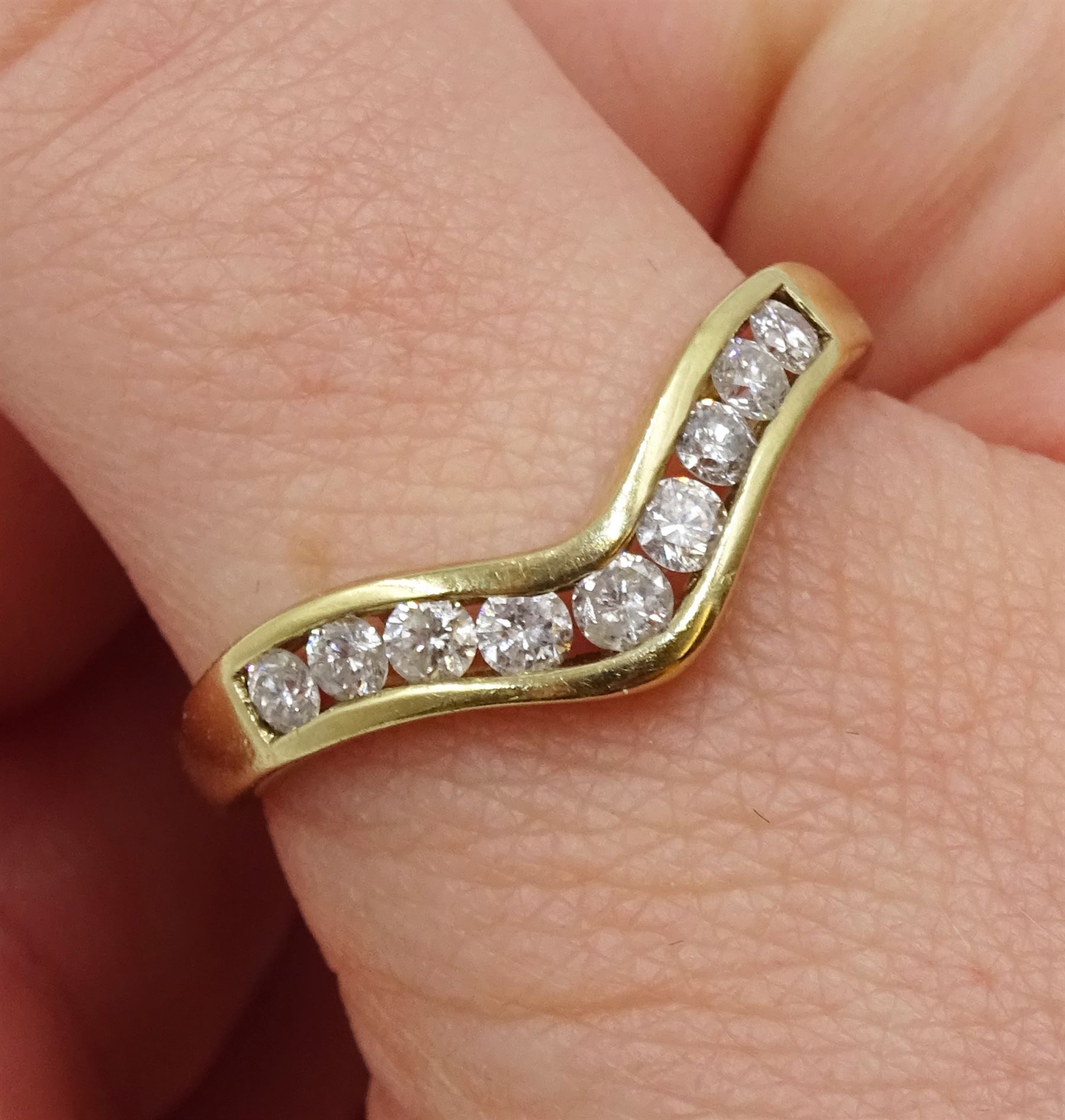 9ct gold diamond channel set wishbone ring, hallmarked, total diamond weight 0.50 carat