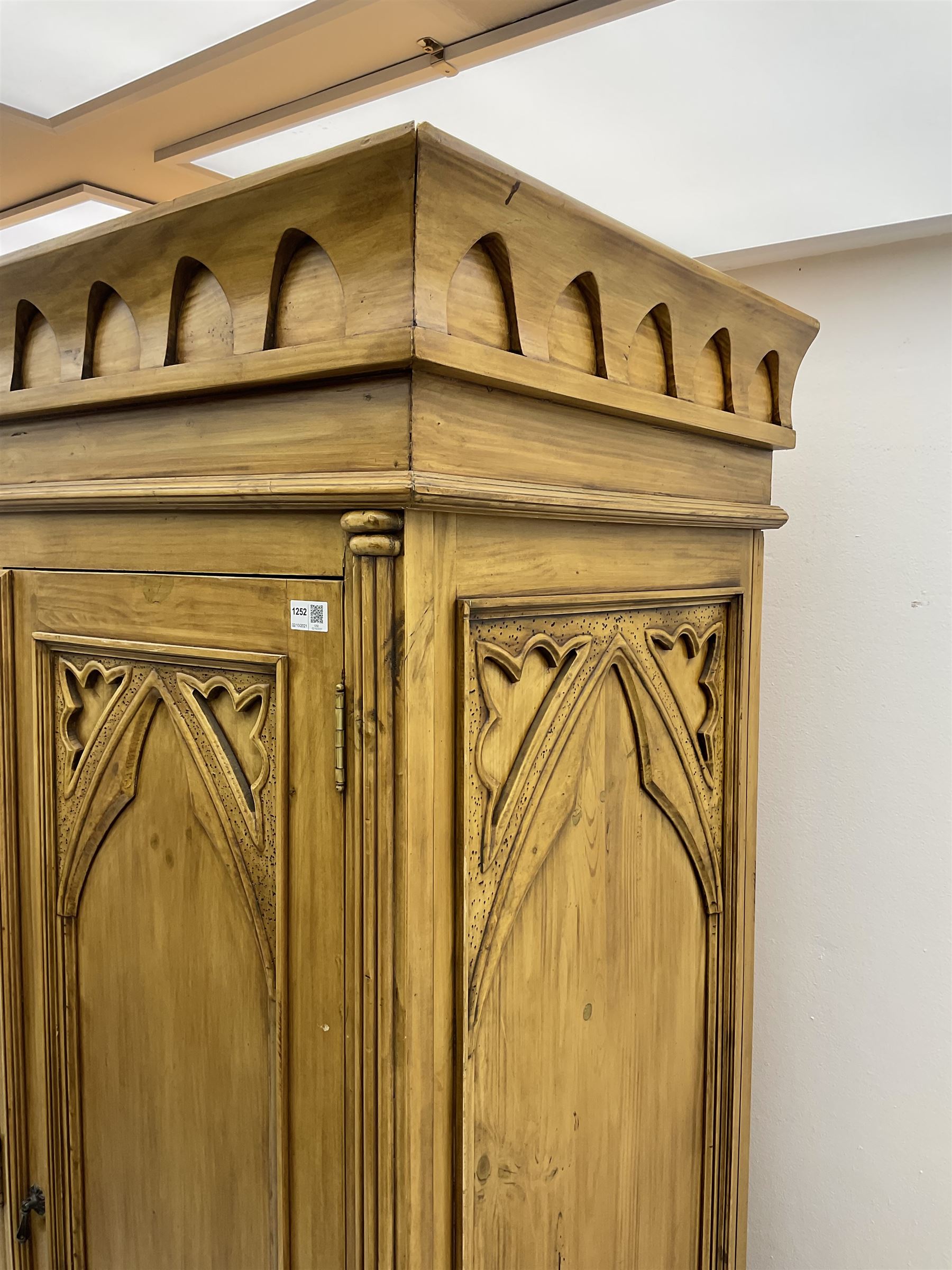 Gothic polished pine triple wardrobe, fitted with five drawers 