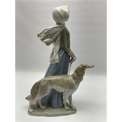 Three Lladro figure groups, comprising Clown no 4618, Lady with Greyhound no 4594 and Playful Piglets no 5228, largest H40cm