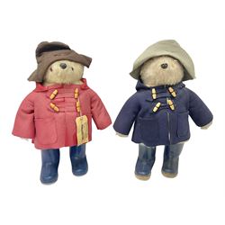 Pair of Paddington Bear teddies with amber eyes, the first example having a brown felt hat, red coat and blue PB boots with original label; the second having a grey felt hat, blue coat and blue Dunlop boots, tallest H51cm 