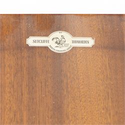 Sutcliffe of Todmorden - mid 20th century ‘S-Form’ teak dining table and chairs, the circular storable extending table with plain veneered top on tapered supports, together with matching dining chairs upholstered in black vinyl, with curved slat backs and shaped front supports, reflecting the sleek organic styling characteristic of 1960s British modern furniture design (Chairs H 93cm, W 46cm, D 46cm) (Extended 168cm)