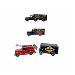 Timpo Toys - four unboxed and playworn die-cast commercial vehicles comprising Smiths Crisps van; Pickfords Removers van; Ever Ready van; and Fire Engine with ladders (4)