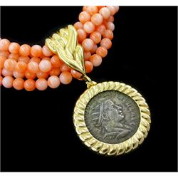 Six strand coral bead necklace, with gold clasp, suspending a detachable Roman silver Denarius coin, loose mounted in a gold pendant
