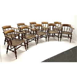 Set ten 19th century elm and beech smokers bow armchairs, raised backs on curved arms with scroll terminals, spindle turned balustrade back, turned elm seats, on turned supports joined by double H stretchers  