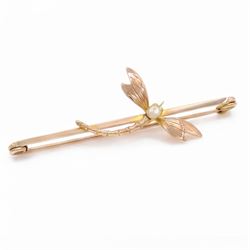 Early 20th century rose gold dragonfly bar brooch, set with a single white / cream pearl, stamped 9ct