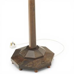 Acornman - dark stained oak standard lamp, supported on an octagonal column terminating in an octagonal base, with carved acorn signature, by the workshop of Alan Grainger of Brandsby 