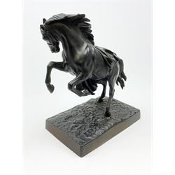A Russian bronzed cast iron figure of a rearing horse, signed to base, overall H38cm. 