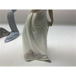 Four Lladro figures, comprising Afternoon Promenade no 7636, Nostalgia no 5071, both with original boxes, Girl with Lilies no 4972 and Madonna no 4534, largest example H27cm